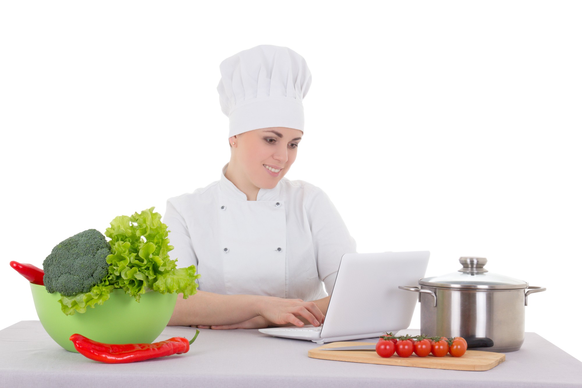 Chef coaching student in kitchen