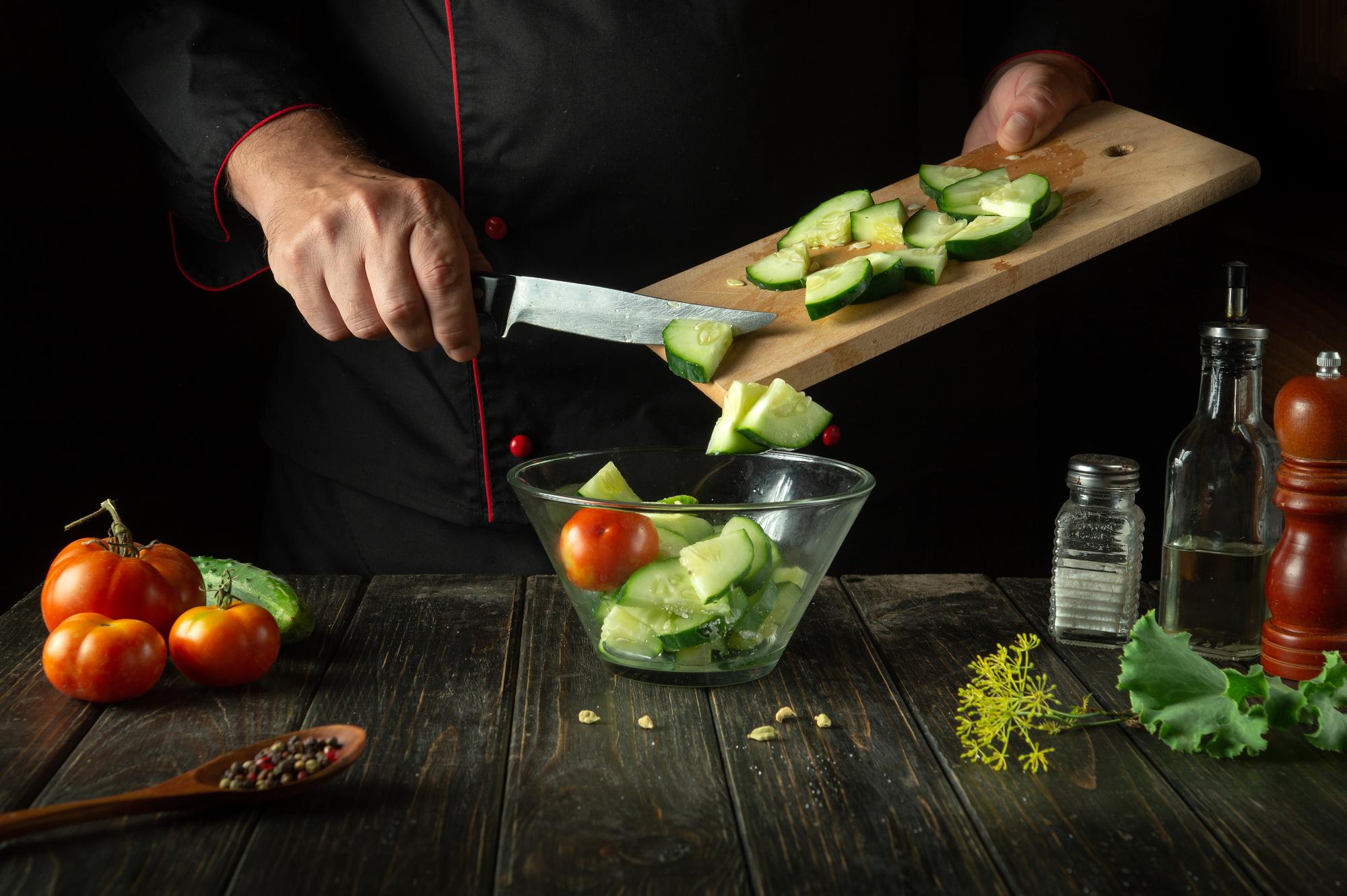 Chef slicing vegetables